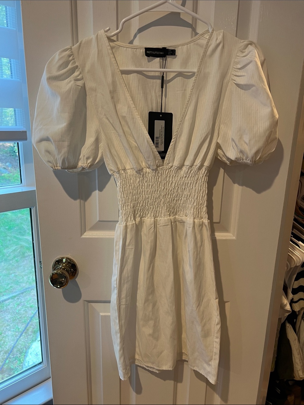 PrettyLittleThing White Puff-Sleeve Smocked Mini Dress